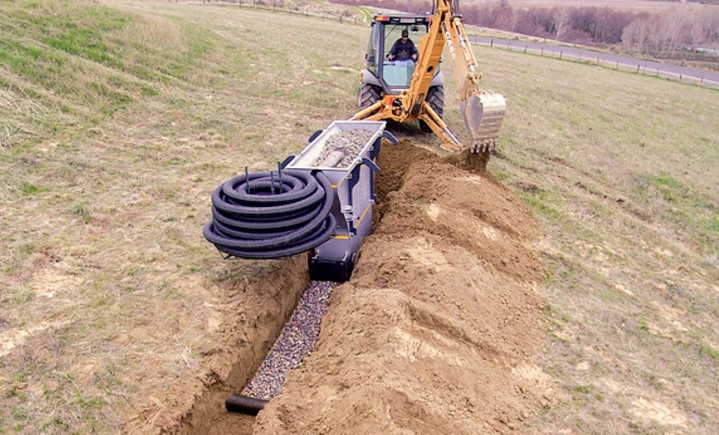 Rockslide allows one worker to install a gravel-and-pipe leach line